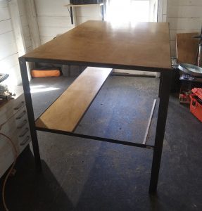 Welded metal table with wood top
