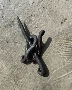 Forged metal decorative fastener