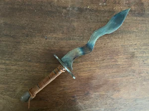 Moro Kris Hand-forged Knife with leather-wrapped handle.