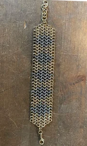Chainmail bracelet made with brass and stainless steel rings.